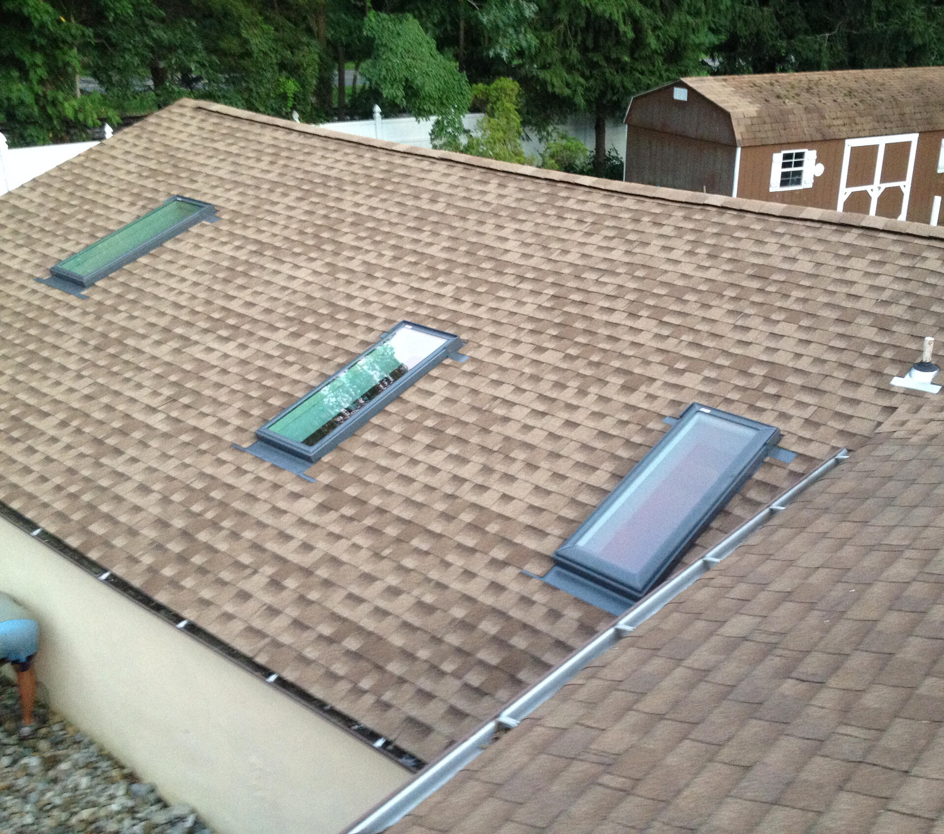 Triple Skylight Installation Three skylights installed on one side